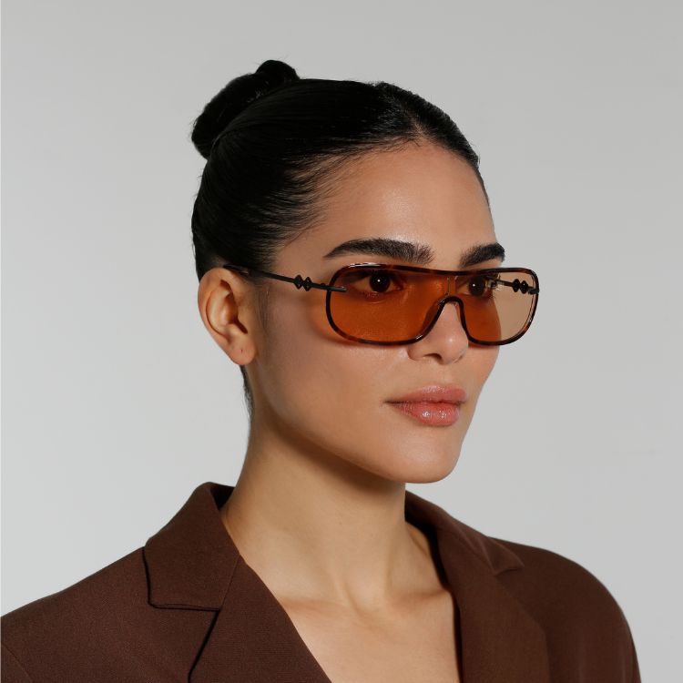 Side view of model wearing sunglasses | Mask sunglasses with brown lenses and tortoise frames | Acetate & Metal | Jordan | Women's sunglasses | Karen Wazen Eyewear