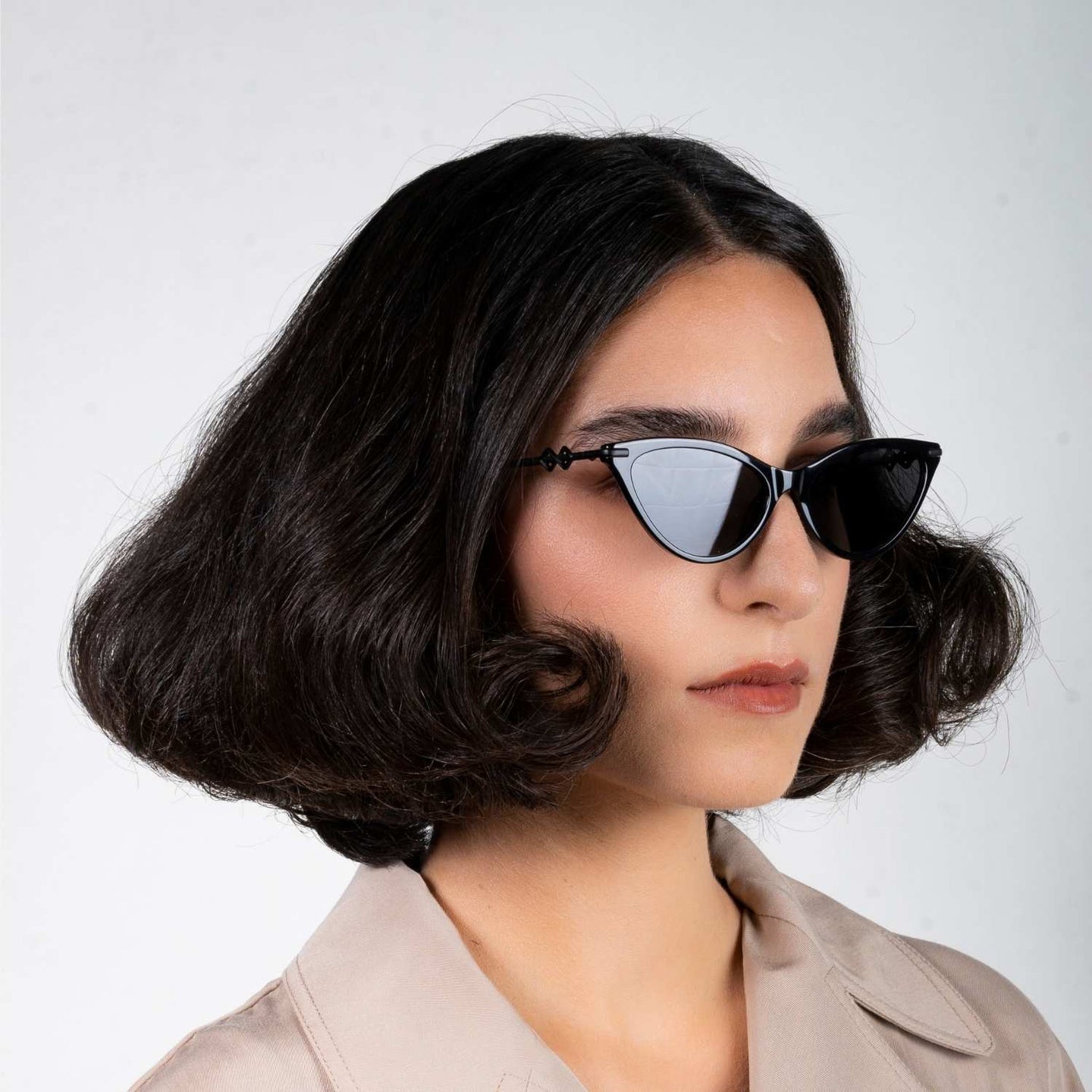 Side view of model wearing sunglasses | Cat-like sunglasses with black lenses and black frames | Metal & Acetate | Kourt | Women's sunglasses | Karen Wazen Eyewear