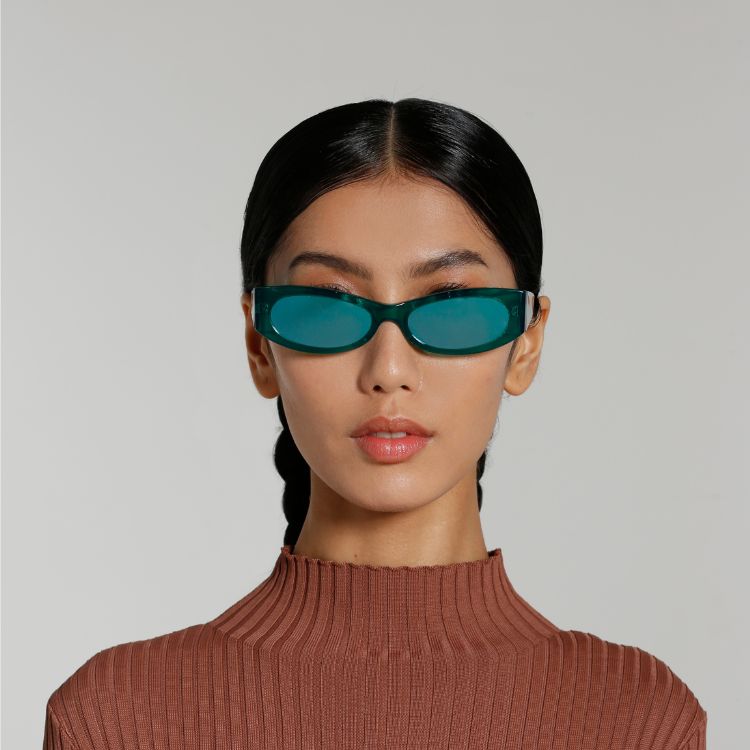 Front view of model wearing sunglasses | Cat-like sunglasses with green mirror lenses and green frames | Acetate | Ciara | Women's sunglasses | Karen Wazen Eyewear