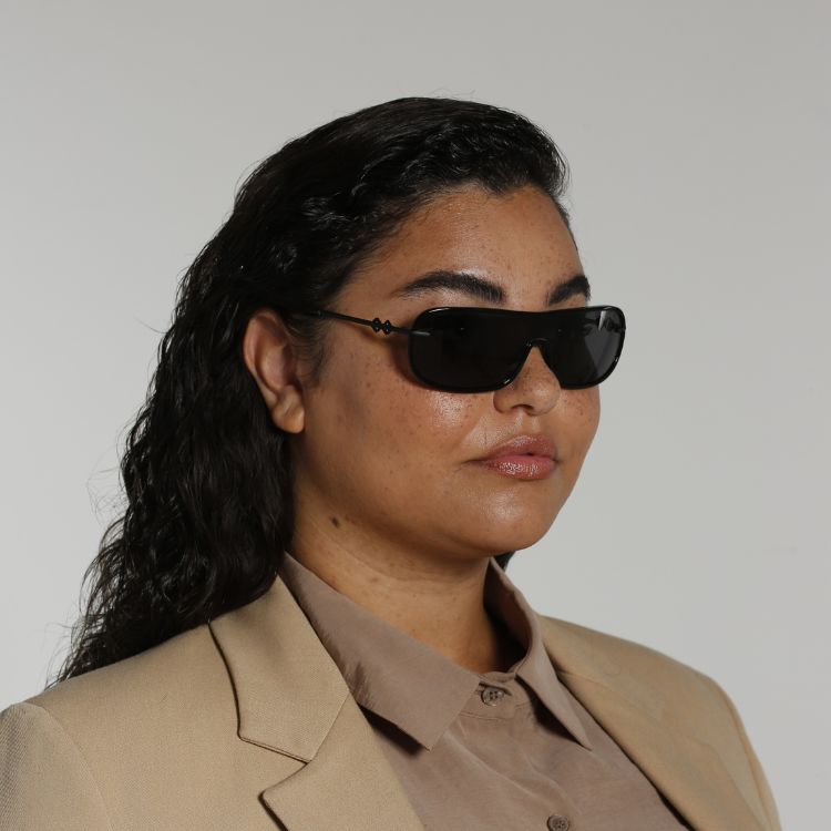 Side view of model wearing sunglasses | Mask sunglasses with black lenses and black frames | Acetate & Metal | Jordan | Women's sunglasses | Karen Wazen Eyewear