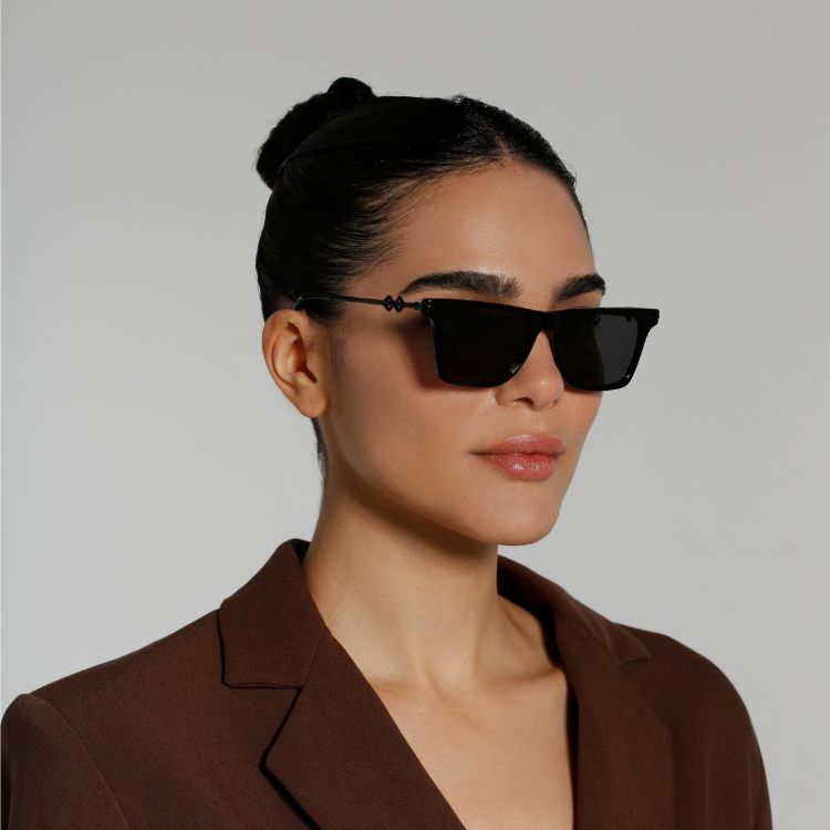 Side View of model wearing sunglasses | Wayfarer sunglasses with black lenses and black frames | Metal | Harper | Women's, men's, and unisex sunglasses | Karen Wazen Eyewear