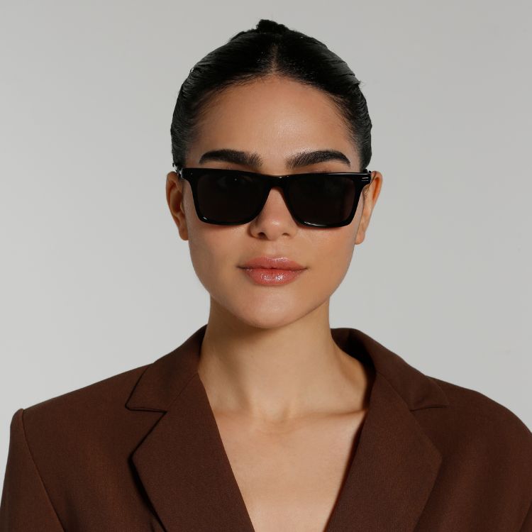 Front View of model wearing sunglasses | Wayfarer sunglasses with black lenses and black frames | Metal | Harper | Women's, men's, and unisex sunglasses | Karen Wazen Eyewear
