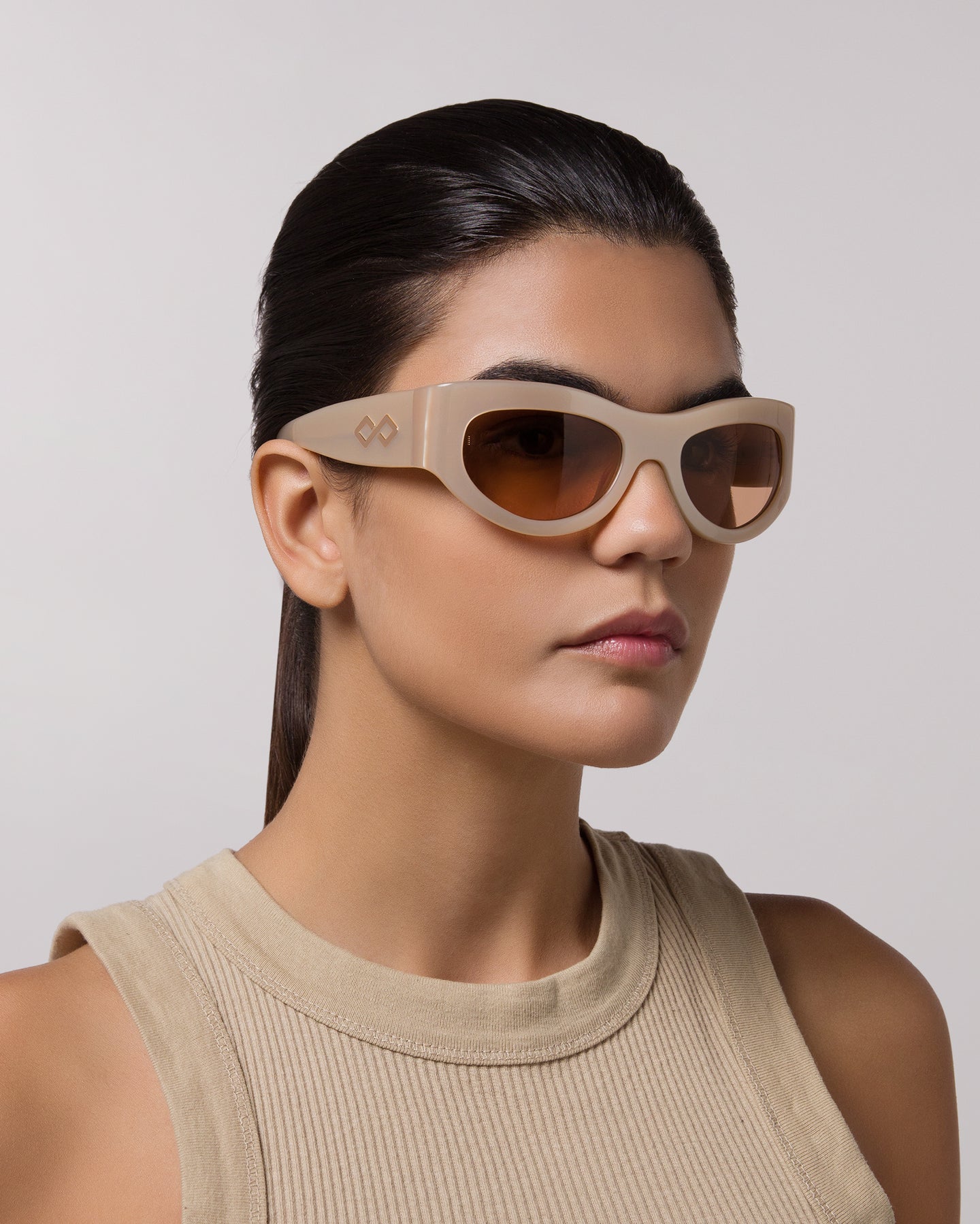 Side view of model wearing sunglasses  | Mask sunglasses with cream lenses and tortoise frames |  Acetate | Swim | Women's sunglasses | Karen Wazen Eyewear